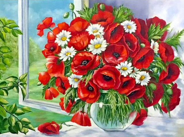 Papaverbloemen in een glazen vaas